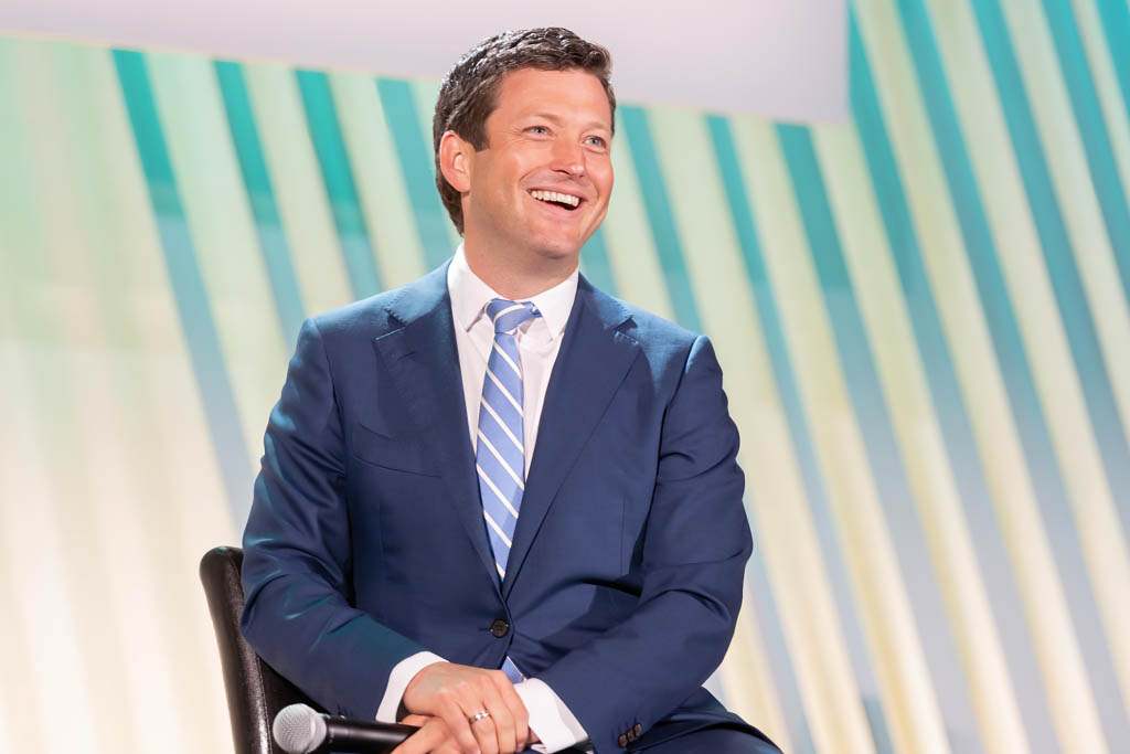 Speaker presenting at a corporate conference