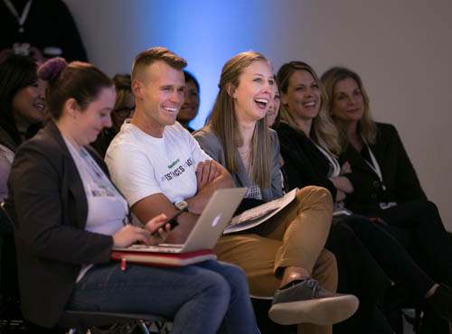 Audience laughing during a corporate event