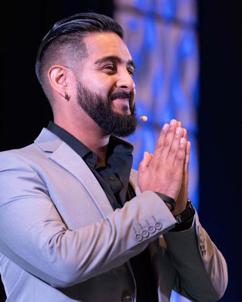 Speakers on stage at a corporate conference